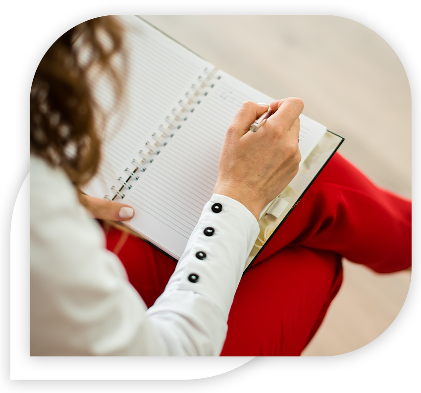 woman writing in notebook