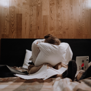 woman crying in bed