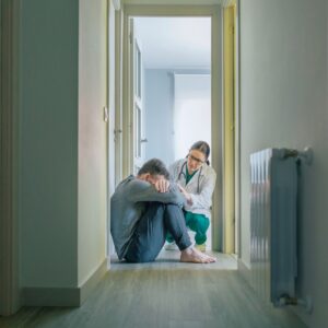 depressed man in hallway