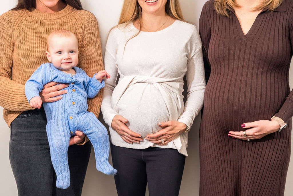 pregnant women and a woman holding a baby